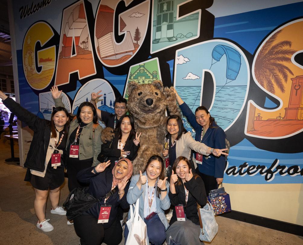 People in front of a graffiti walls 