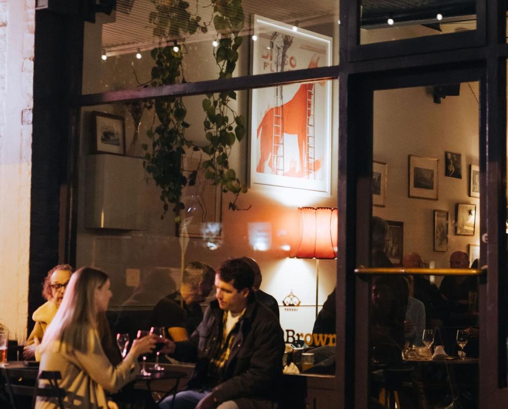 a couple sitting outside of Mrs Browns bar in North Fremantle 